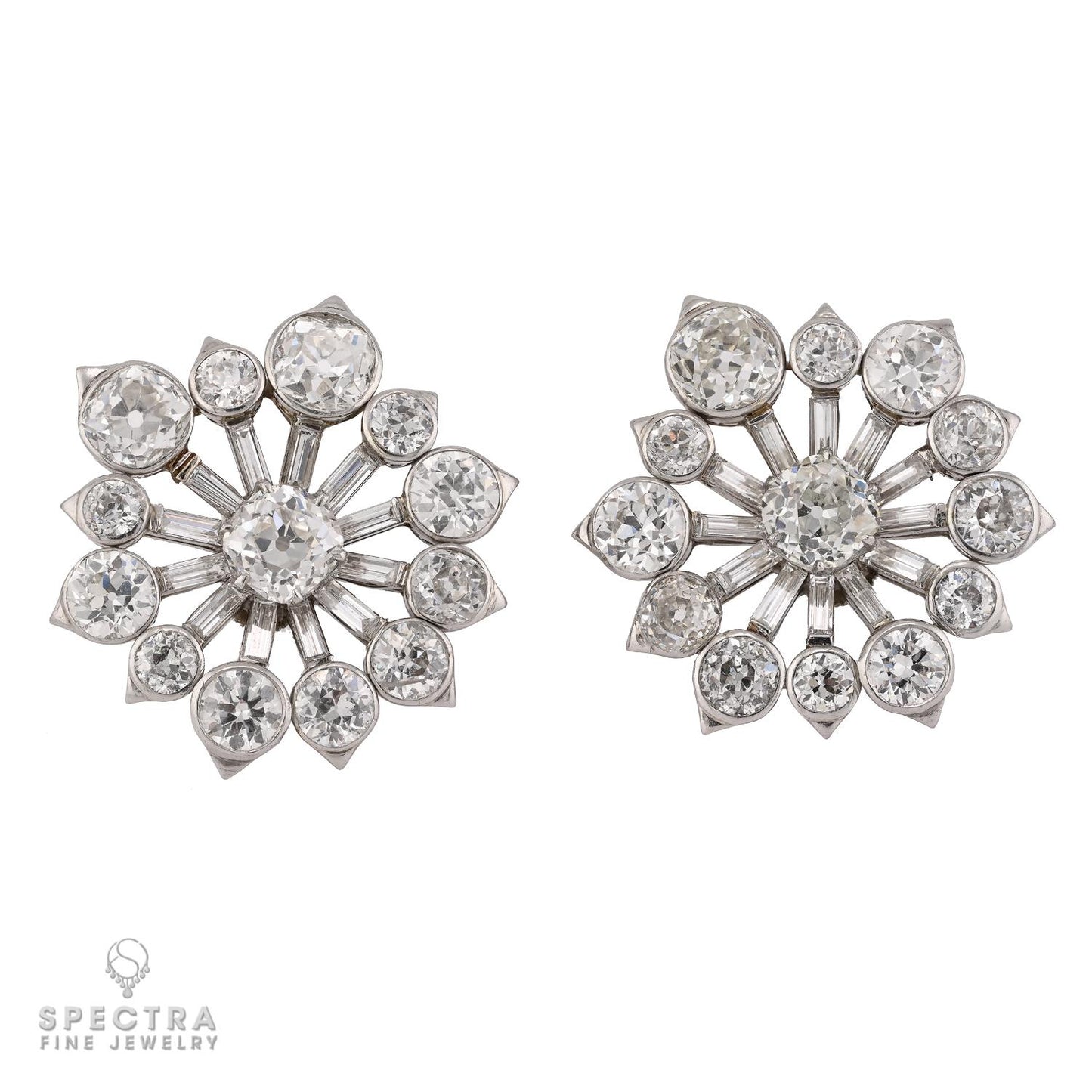 Pair laid flat showing starburst design with mixed-cut diamonds. VCA