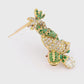 'Deux Dauphins' Diamond and Emerald Gold Brooch by Boivin