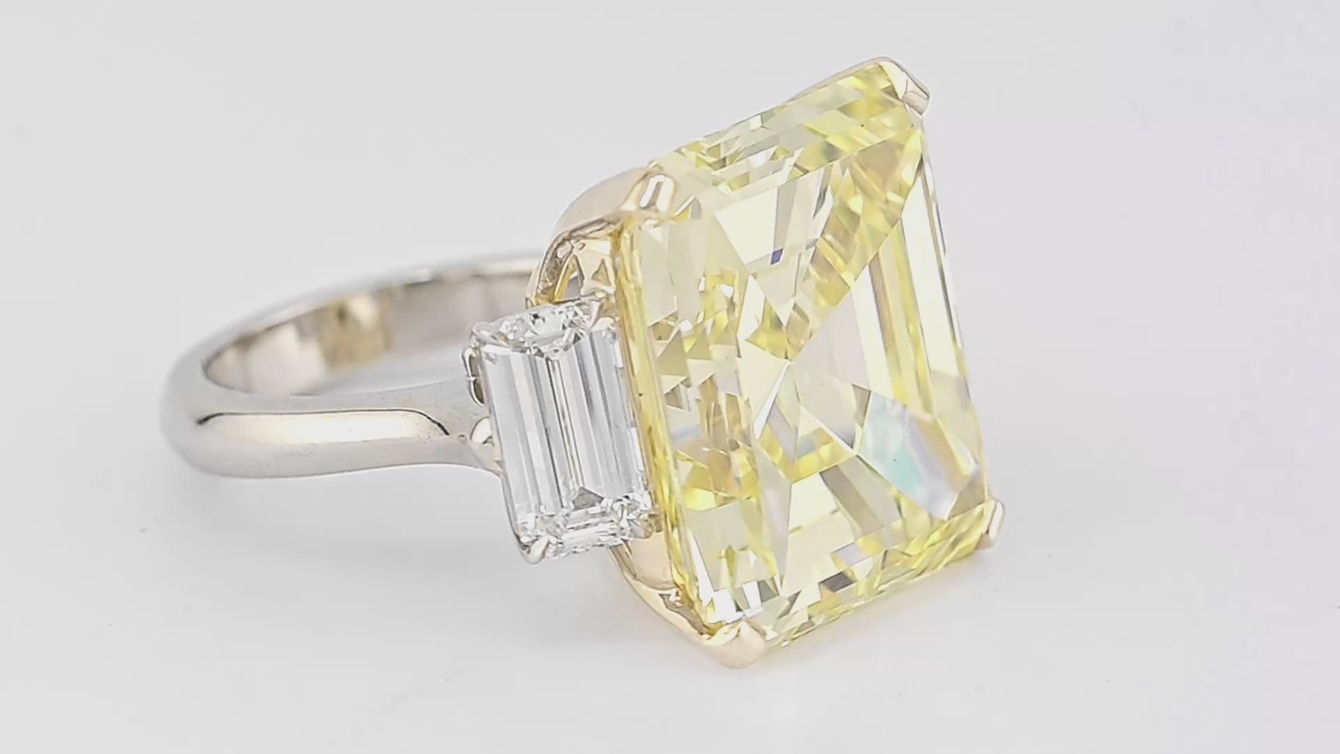 25.02ct Intense Yellow Diamond Three-Stone Ring